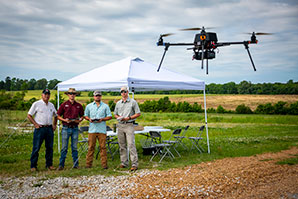 students flying a drone